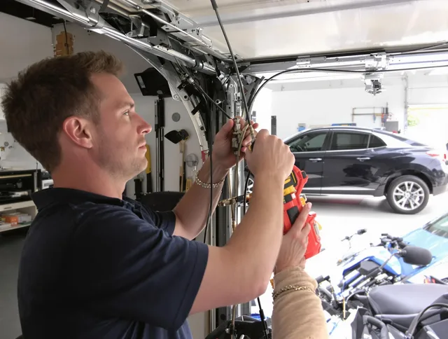 Deltona Garage Door Repair safety certified technician performing cable replacement in Deltona