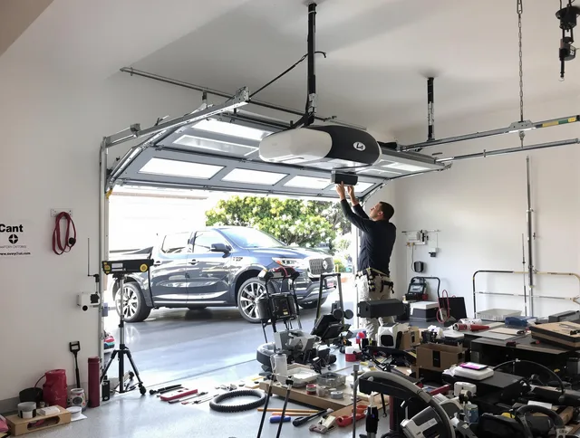 Deltona Garage Door Repair specialist installing smart garage door opener system in Deltona home